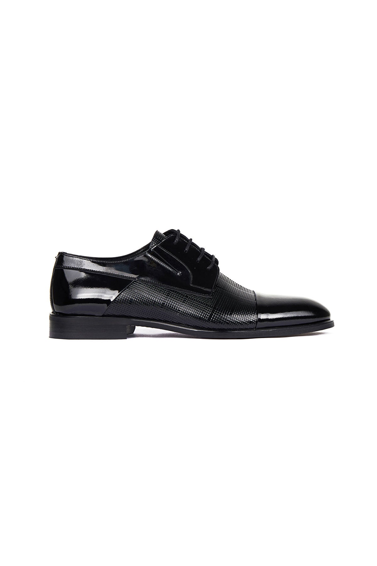 Black patent leather and textured suede oxford shoe with a glossy toe cap.