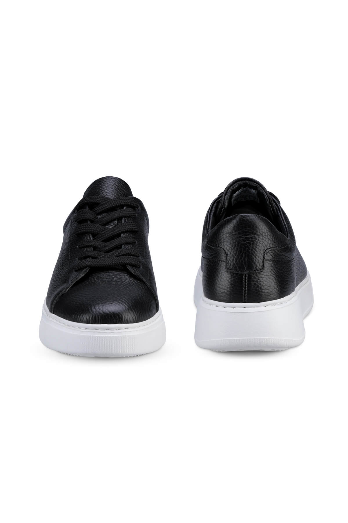 Black leather sneakers with a white rubber sole and black laces.