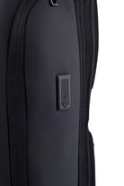 Black textured fabric backpack with a sleek usb charging port panel.