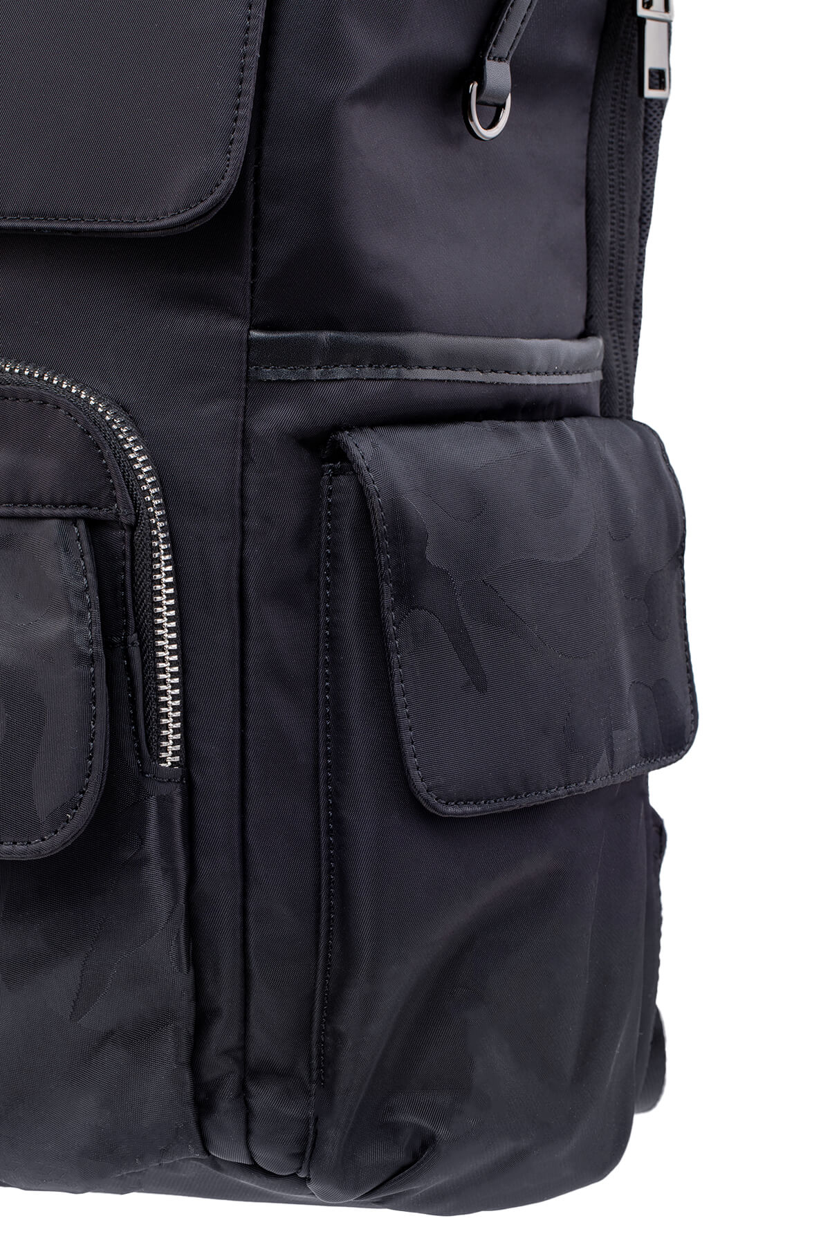 Black nylon backpack with subtle camouflage pattern and multiple zippered pockets.