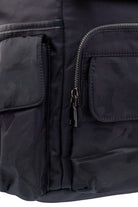 Black nylon backpack with subtle camouflage pattern and silver zipper pulls.
