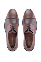Brown and dark brown two-tone leather dress shoes with a cap toe design.
