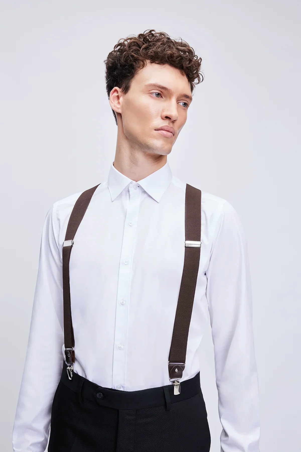 Brown leather trim clip suspenders with silver-toned metal clasps for stylish and secure fit