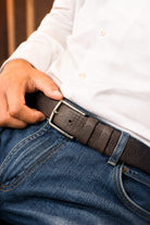 Brown sport faux leather belt with textured finish and silver toned rectangular buckle for casual wear
