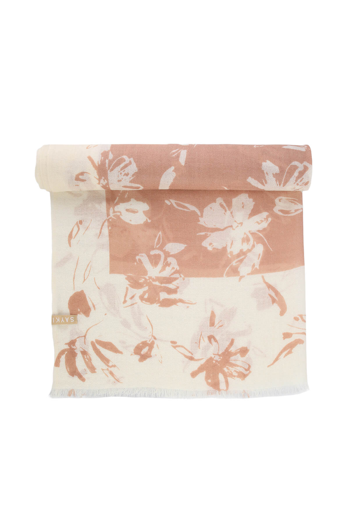 A soft peach and cream floral-patterned scarf with a delicate, fringed edge.
