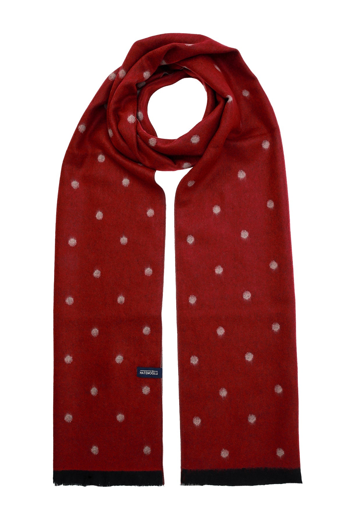 A rich red scarf with a subtle pattern of small, light-colored embroidered dots and black fringed edges.