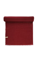 A rich burgundy woolen scarf with a soft, textured weave and neatly fringed edges.