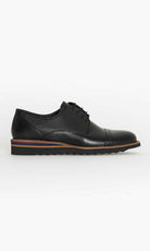Black leather derby shoe with a perforated panel and multicolored stripe along the sole.