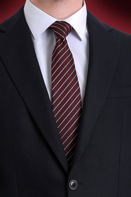 A maroon tie with thin white diagonal stripes, made of a smooth woven fabric.