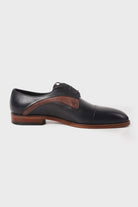 Black leather dress shoe with a contrasting brown leather accent along the side and matching brown sole.