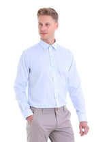 Light blue, long-sleeved men’s dress shirt with a classic collar and button-down front.