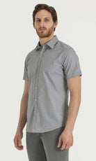 Gray short-sleeved button-down shirt with a subtle checkered pattern.