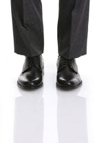 Black leather dress shoes with a polished finish and classic lace-up design.