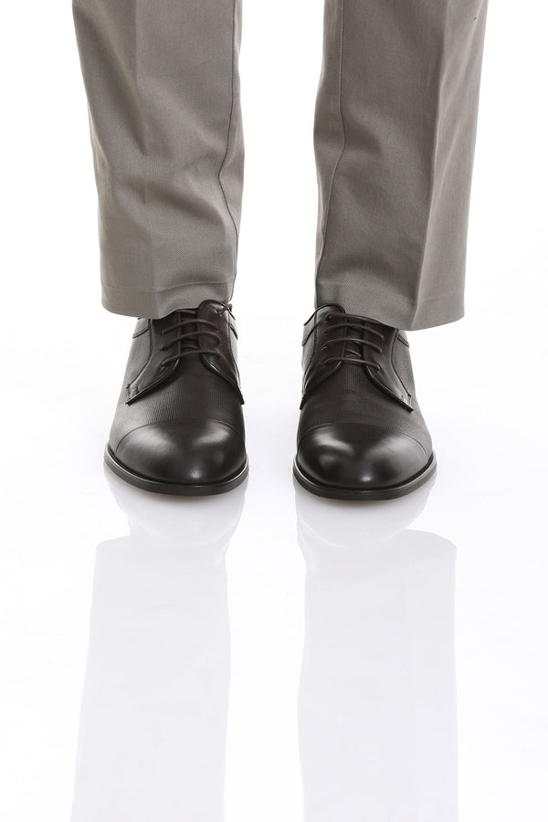 Black leather dress shoes with a polished finish and classic lace-up design.