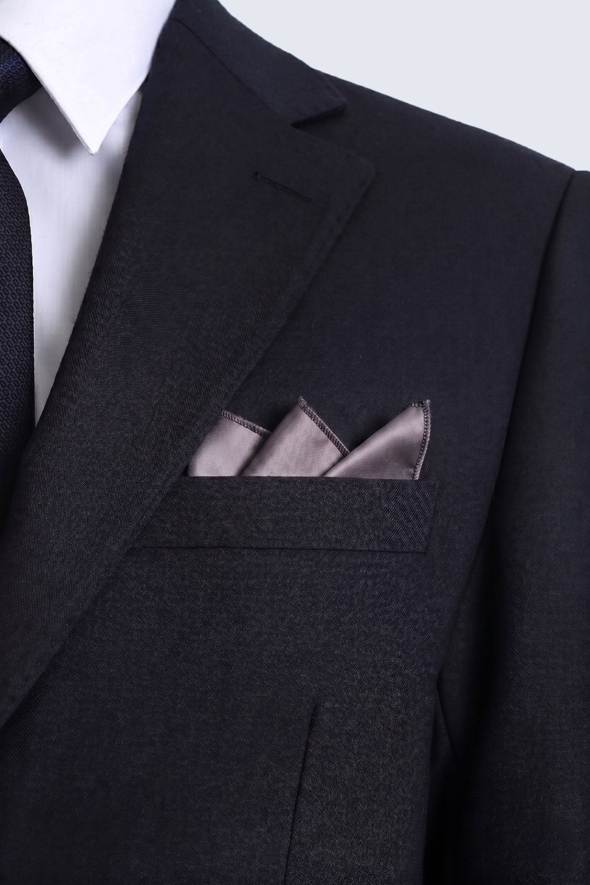 A sleek black suit jacket with a classic sateen solid lavender pocket square featuring a silver-tone finish