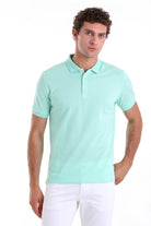 A men’s mint green short-sleeved polo shirt with a classic collar and button placket.