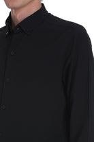 Black button-down shirt with a crisp collar and subtle texture.