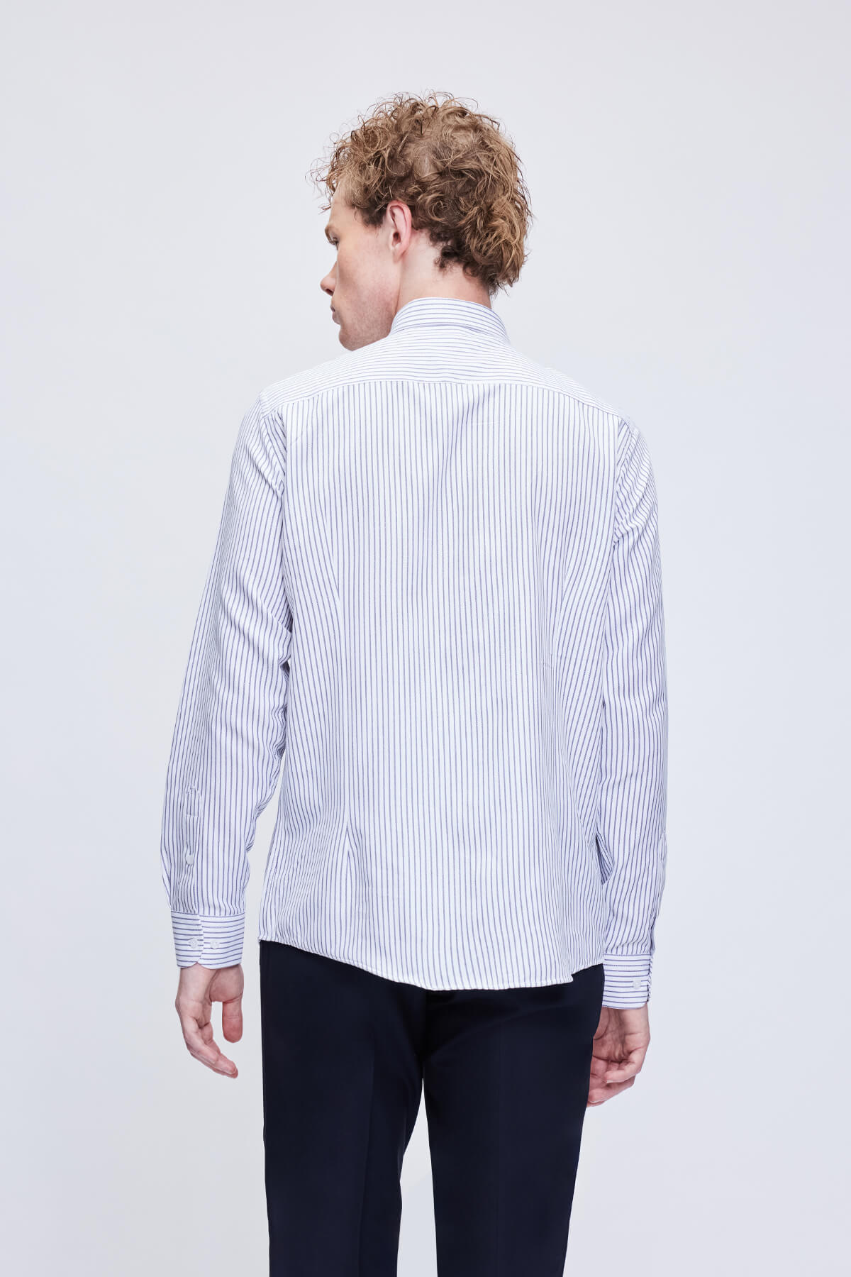 A crisp white and navy blue vertically striped long-sleeved dress shirt with a classic collar.