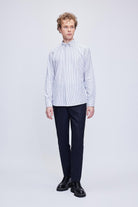 A crisp white and navy blue vertically striped long-sleeved button-down shirt with a classic collar.