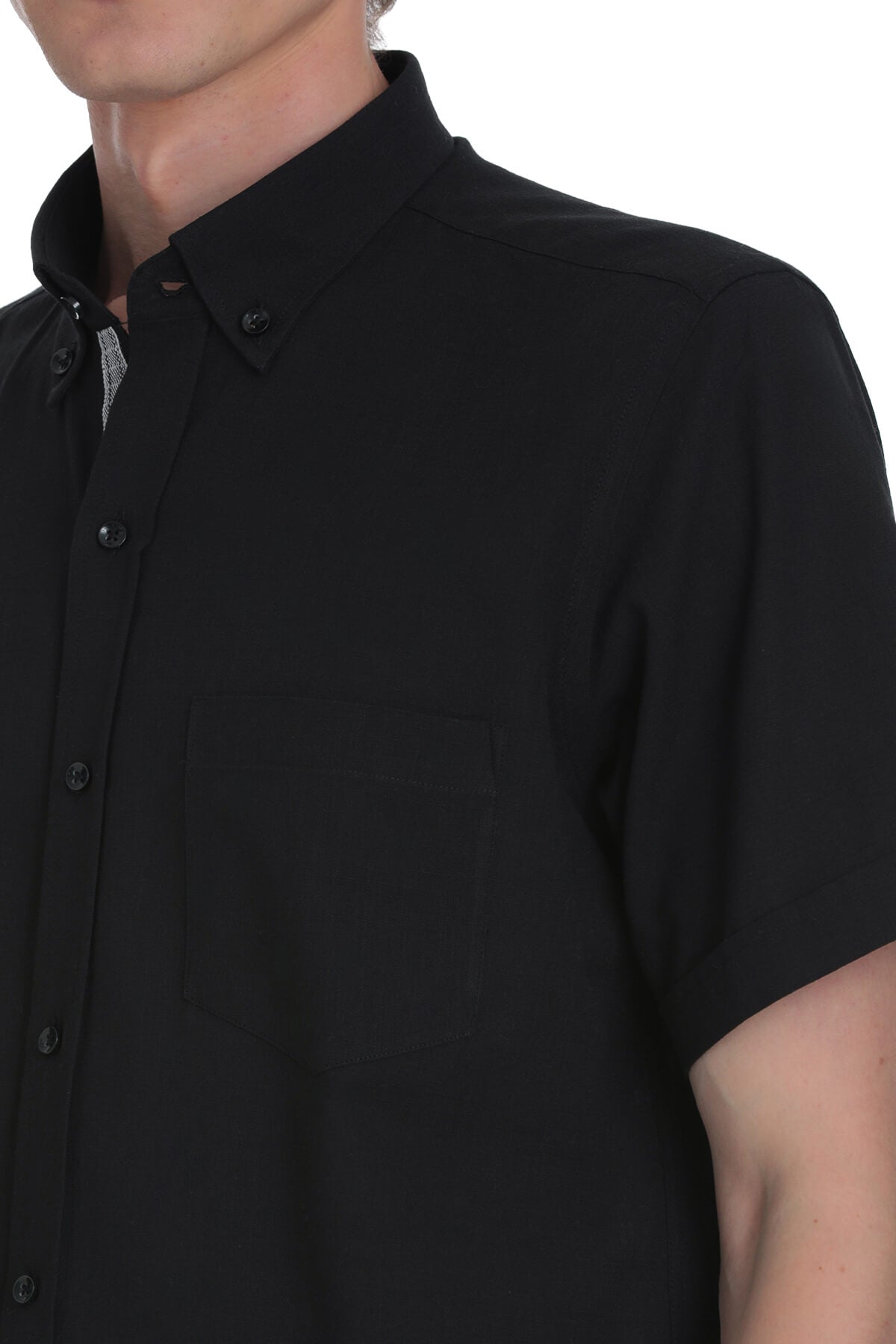 Black short-sleeved button-down shirt with a crisp collar and matching buttons.
