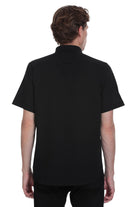 Black short-sleeved collared shirt.
