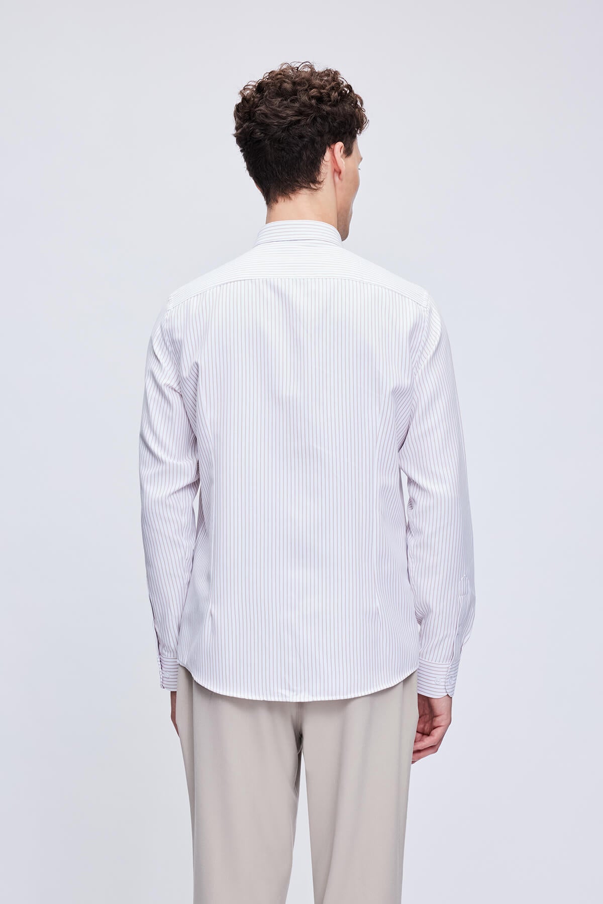 A crisp white and light blue vertically striped long-sleeved dress shirt with a classic collar.