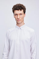 A crisp white button-down shirt with fine vertical gray pinstripes.