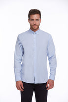 Light blue, long-sleeved men’s dress shirt with a classic button-down collar and neatly pressed fabric.