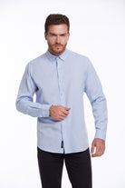 Light blue long-sleeved button-down shirt with a classic collar and subtle texture.
