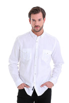 White long-sleeved button-down shirt with chest pockets and a collar.