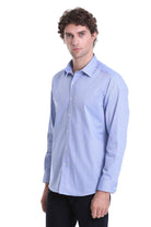 Light blue, long-sleeved men’s dress shirt with a classic collar and button-down front.