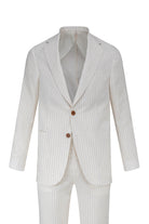 A crisp white pinstripe suit with subtle vertical stripes and matching trousers, featuring brown buttons.