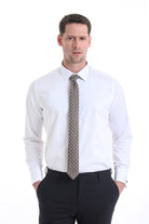 A man wearing a comfort fit french cuff 100 percent cotton white tuxedo shirt with a brown tie with white polka dots