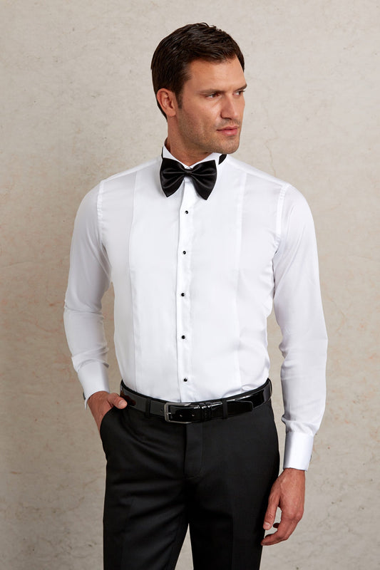 White tuxedo shirt with black buttons and a matching bow tie.
