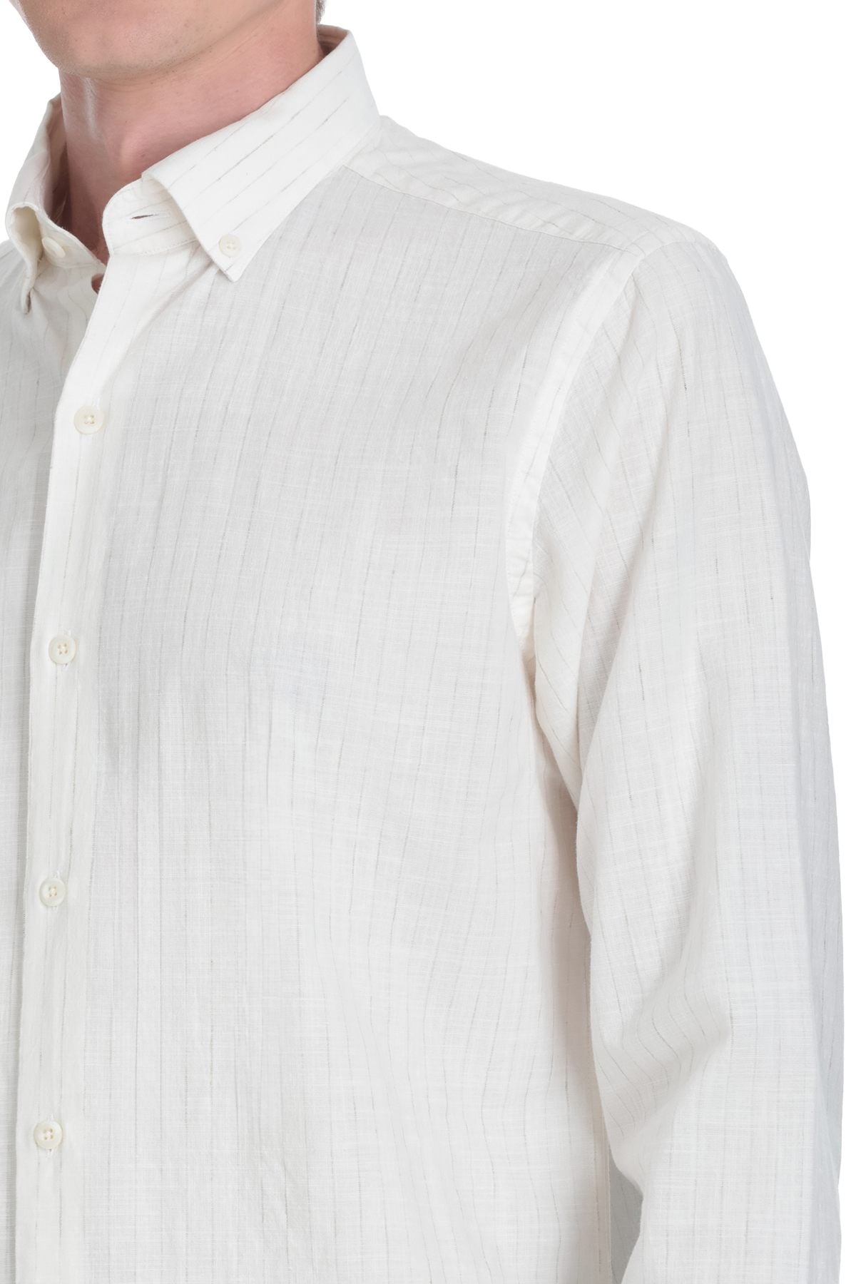 A crisp white button-down shirt with a subtle textured weave and classic collar.