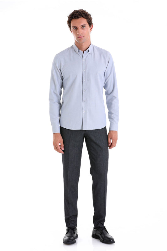 A light blue, long-sleeved button-down shirt with a classic collar and neatly pressed fabric.