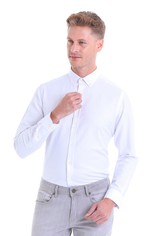 A crisp white long-sleeved dress shirt with a classic collar and button-down front.
