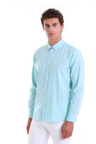 A light blue, long-sleeved button-down shirt with a classic collar and neatly pressed fabric.
