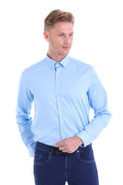 Light blue long-sleeved button-down shirt with a classic collar and neatly pressed fabric.