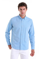 Light blue long-sleeved button-down shirt with a classic collar and neatly stitched cuffs.