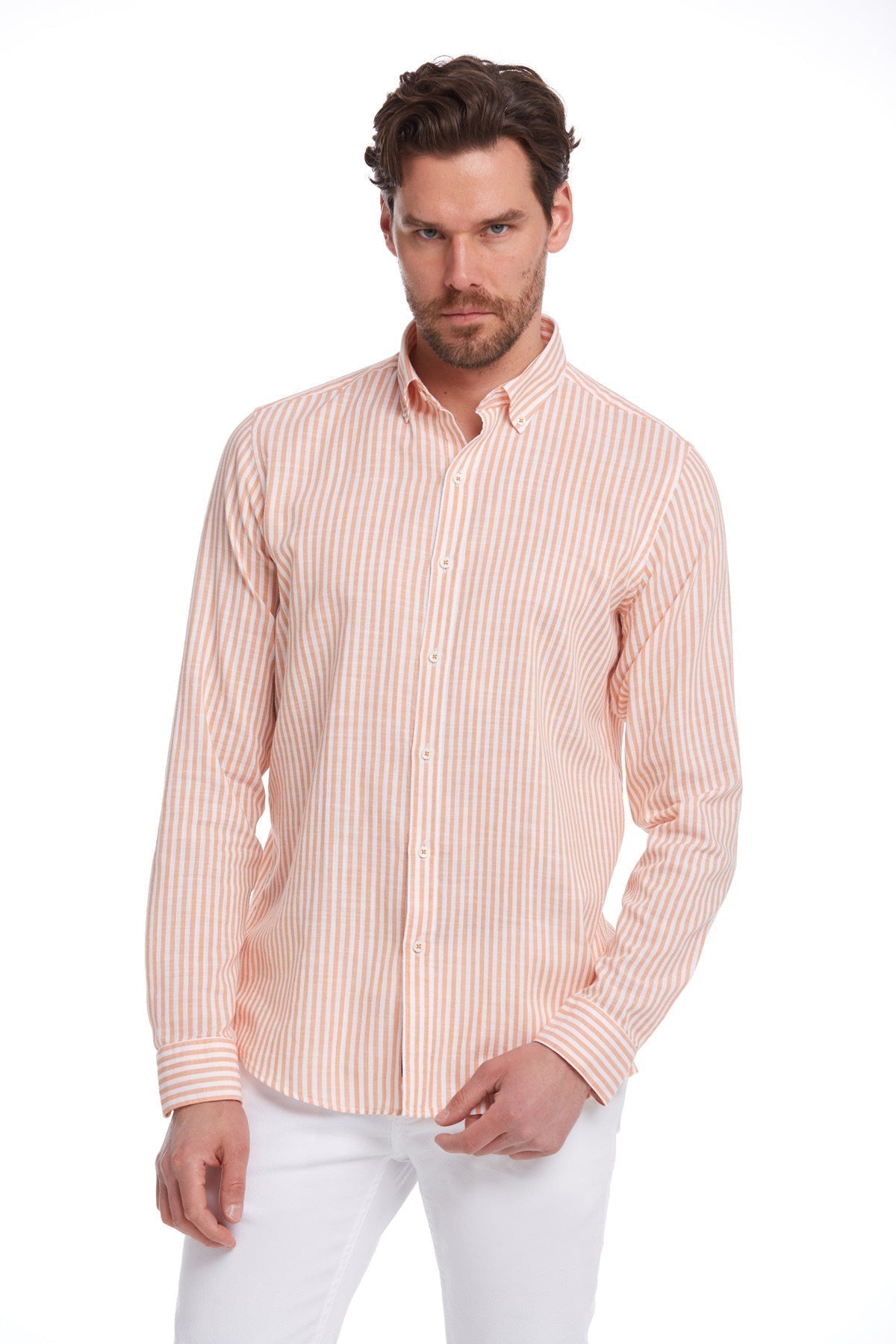 A men’s long-sleeved button-down shirt in soft peach and white vertical stripes, crafted from a lightweight cotton blend with neatly folded cuffs.