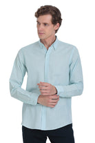 A light blue, long-sleeved button-down shirt with a classic collar and neatly pressed fabric.