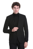Black tailored blazer with notched lapels and a single button closure.