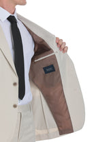 Beige men’s blazer with brown interior lining and a black ’sayki’ brand label.