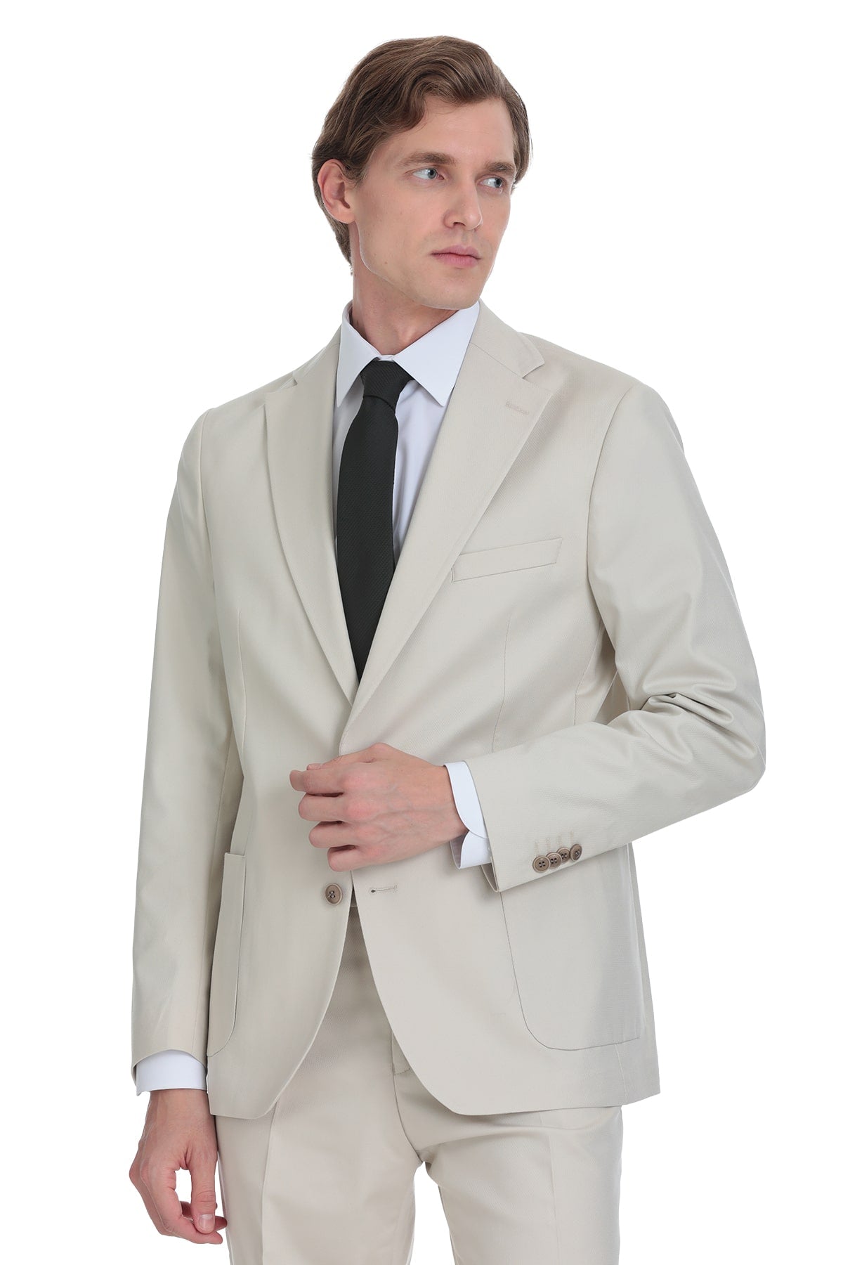 Beige tailored suit jacket with a classic two-button closure and matching trousers.