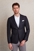 Dark navy blazer with a sleek, tailored fit and subtle texture.