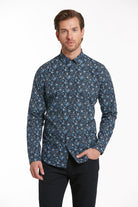 A navy blue long-sleeved button-down shirt with a subtle floral pattern in lighter shades of blue and white.