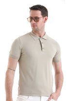 Beige short-sleeved polo shirt with ribbed cuffs and collar.
