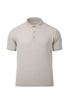 Beige short-sleeved polo shirt with a classic collar and three-button placket.