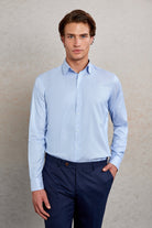 Light blue, long-sleeved men’s dress shirt with a classic collar and button-down front.